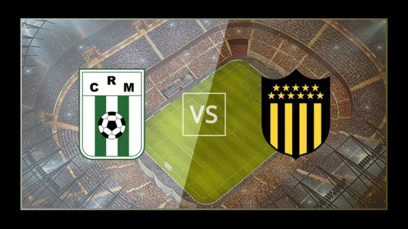 Cầu thủ Racing Montevideo chạy nhanh với bóng trước sự áp đảo từ cầu thủ Penarol Cầu thủ Racing Montevideo chạy nhanh với bóng trước sự áp đảo từ cầu thủ Penarol